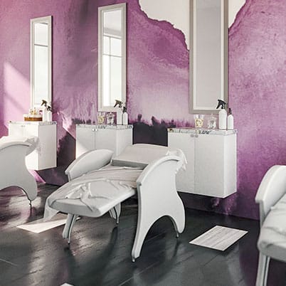 A room with purple walls and white furniture.