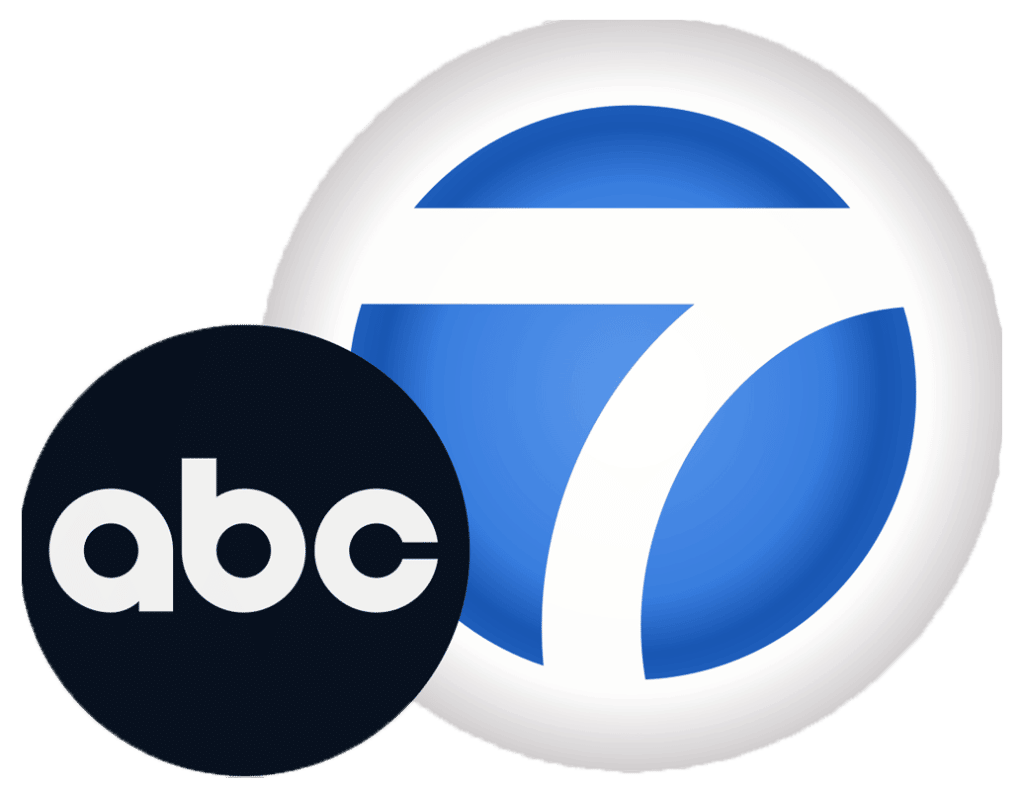 A blue and white logo for abc 7.